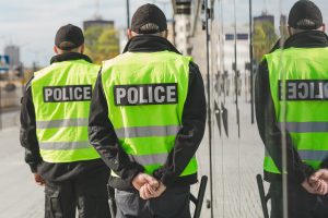 word-police-written-on-reflective-vests-of-police-2025-10-09-11-49-31-utc